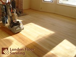 Floor sanding in progress with logo
