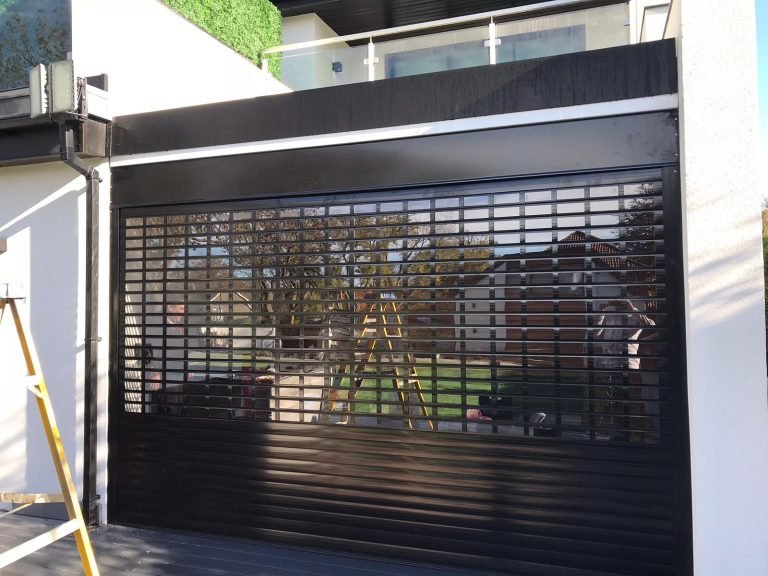 Black roller shutter installed on a building.