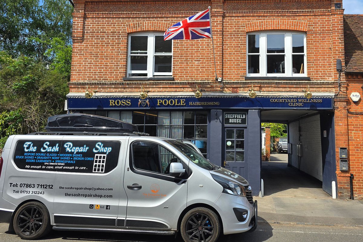 The Sash Repair Shop van in front of a building