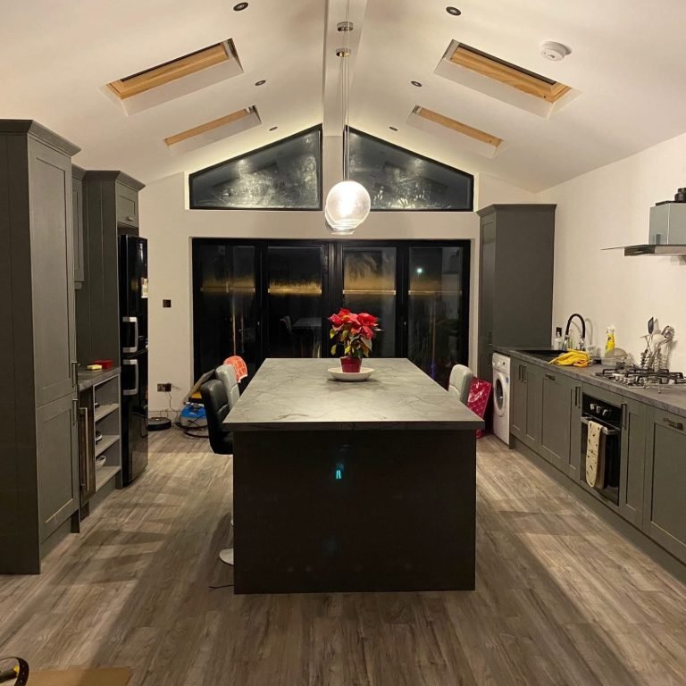 Finished kitchen renovation with modern design and skylights.
