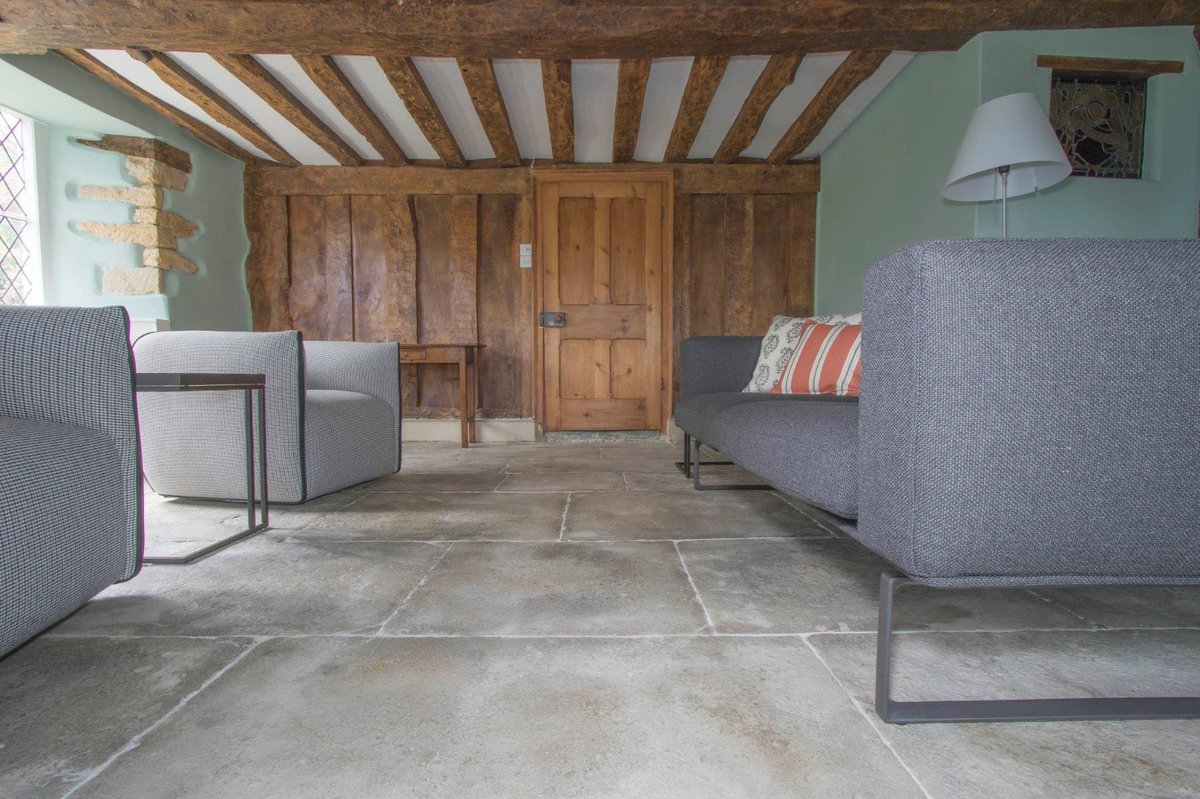 Restored flagstone flooring in a period home living room.