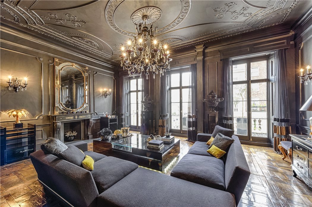 Ornate living room with polished wood accents
