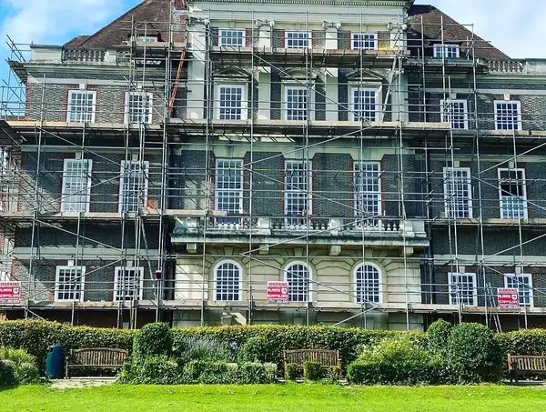 Large building under restoration with scaffolding.