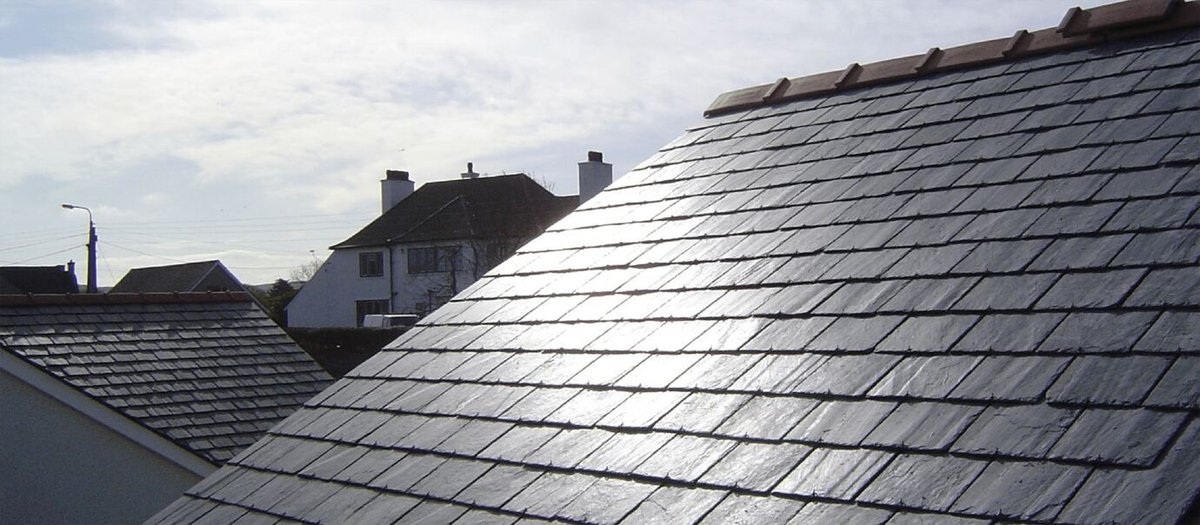 Close-up of a slate roof, potentially showcasing their roofing service.