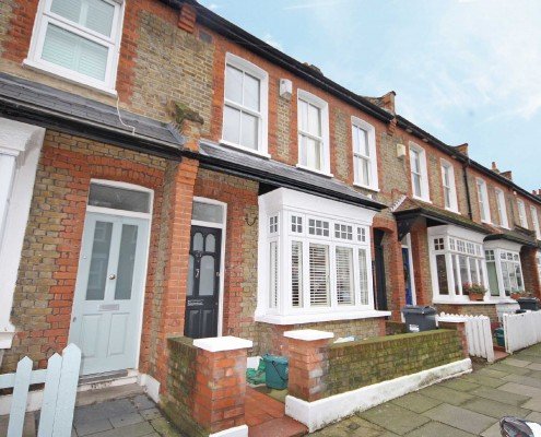 Terraced houses with visible sash windows, potentially showcasing before/after.