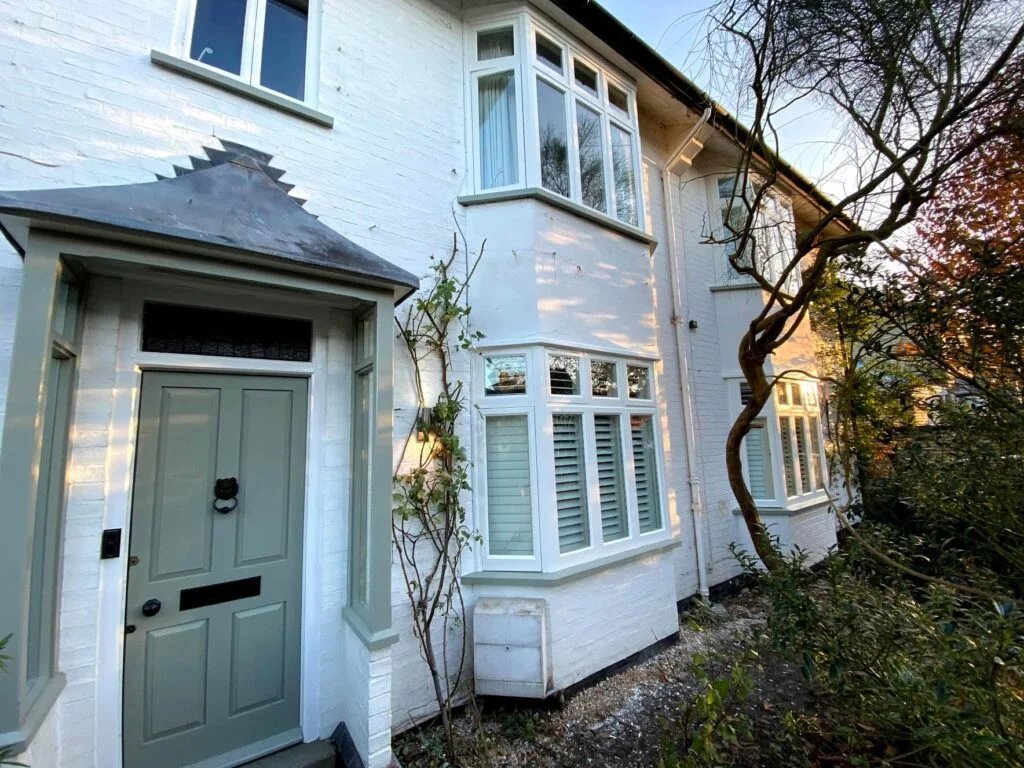 House exterior with sash windows and a porch.