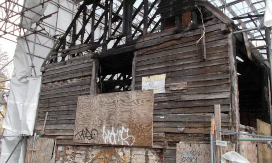 Damaged building under repair. Relevant to building pathology.