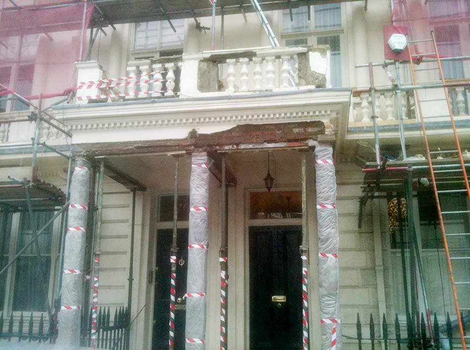 Building restoration in progress with scaffolding