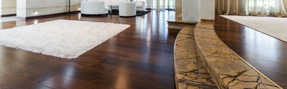 Finished dark wood floor in a modern home, showcasing the refinishing service.