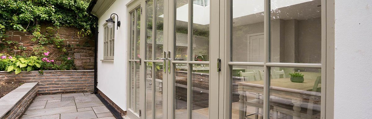 Restored windows and doors leading to a patio.