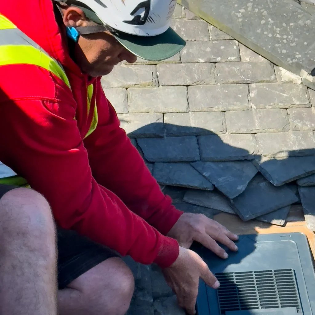 Roofer working on a slate roof