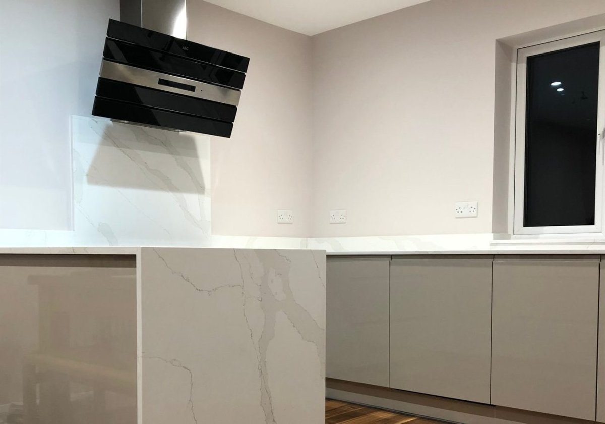 Kitchen renovation with modern appliances and cabinetry.