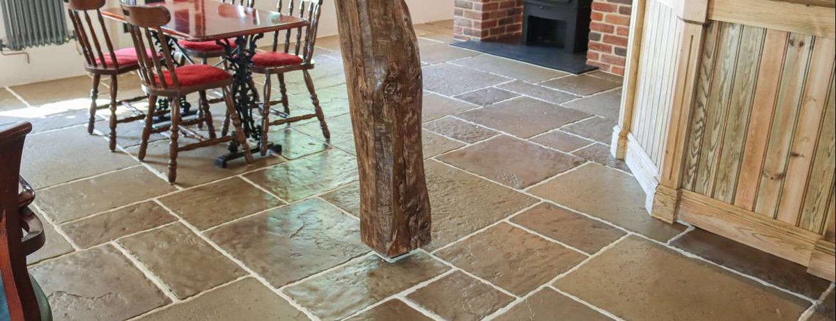 Dining room with flagstone flooring and fireplace