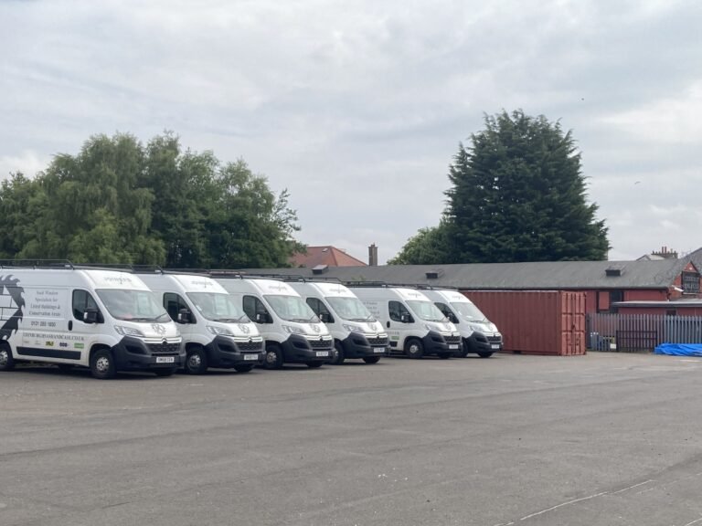 Fleet of company vans, showing scale and professionalism.