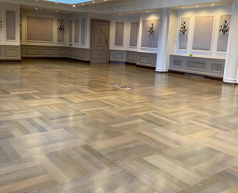 Finished parquet flooring in a large room