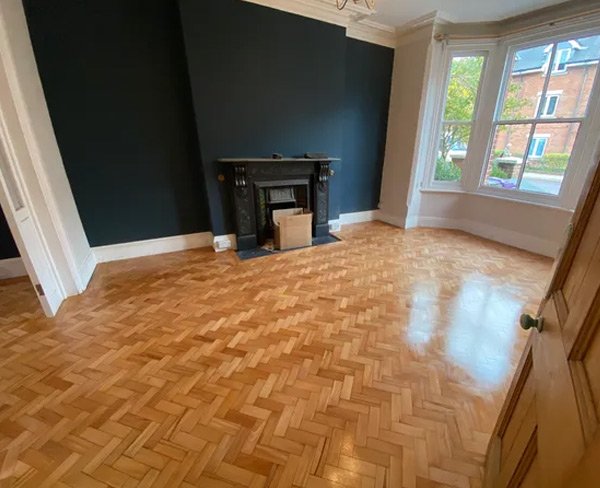 Finished herringbone wood flooring in a room