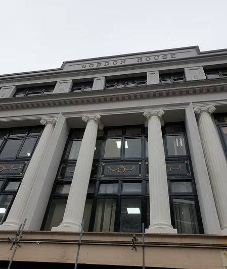 Exterior of Gordon House building, potentially restored by the company.
