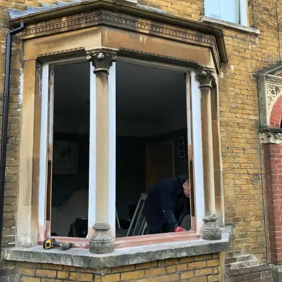 Sash window repair in progress, showing the window frame.