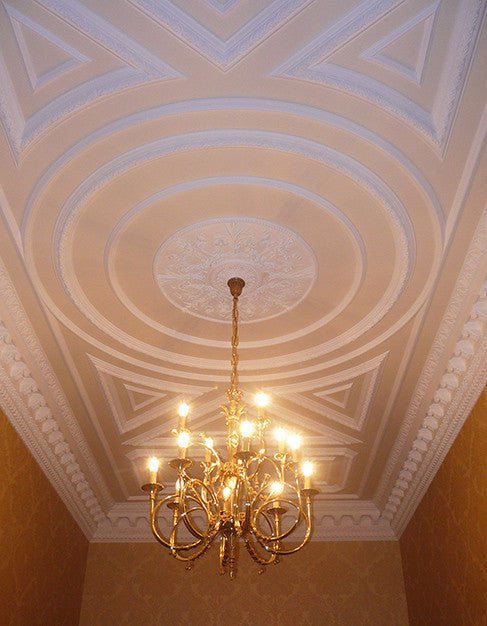 Decorative plaster ceiling with chandelier.