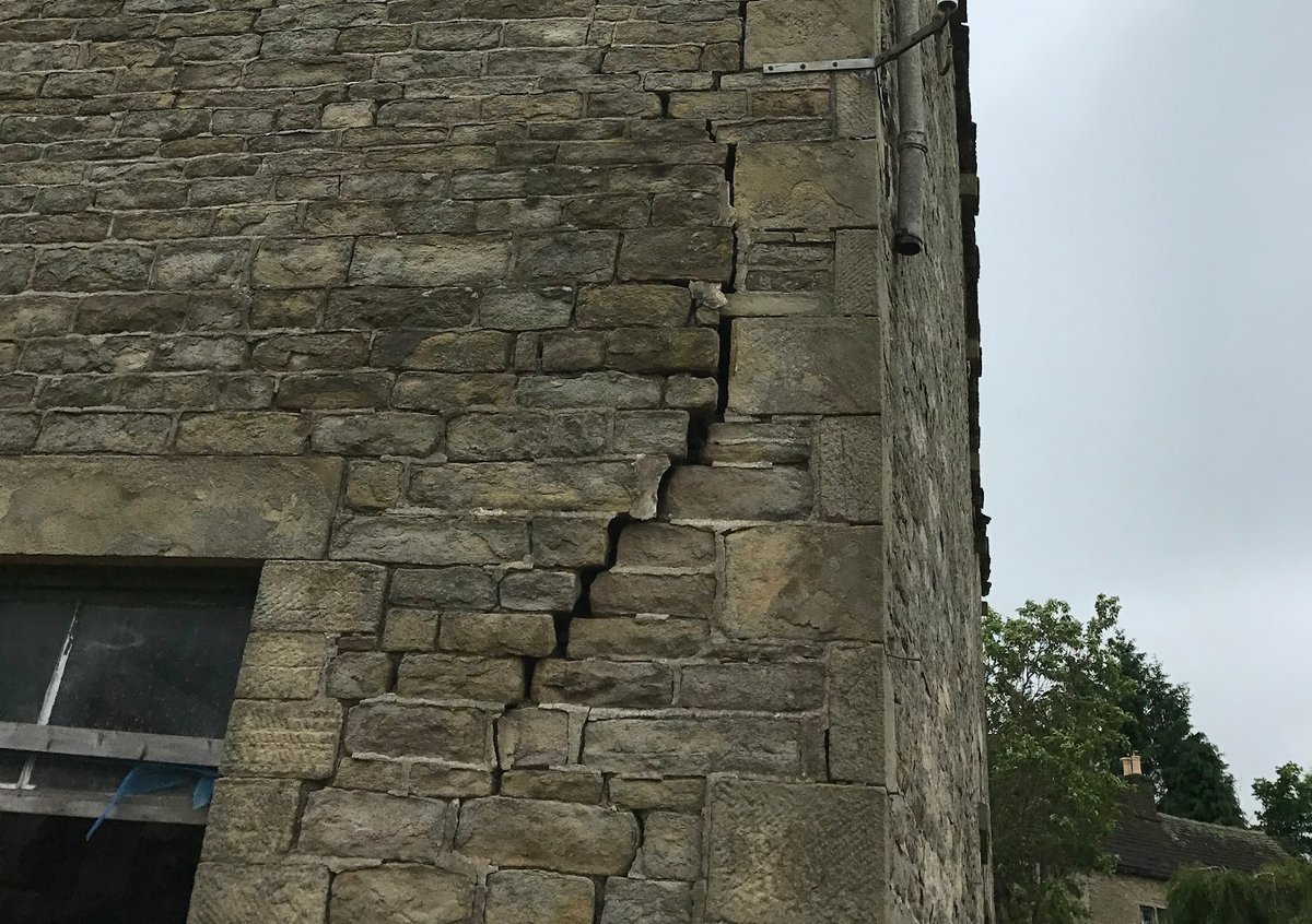 Building with significant structural damage, relevant to building restoration services.