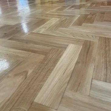Polished herringbone wood floor