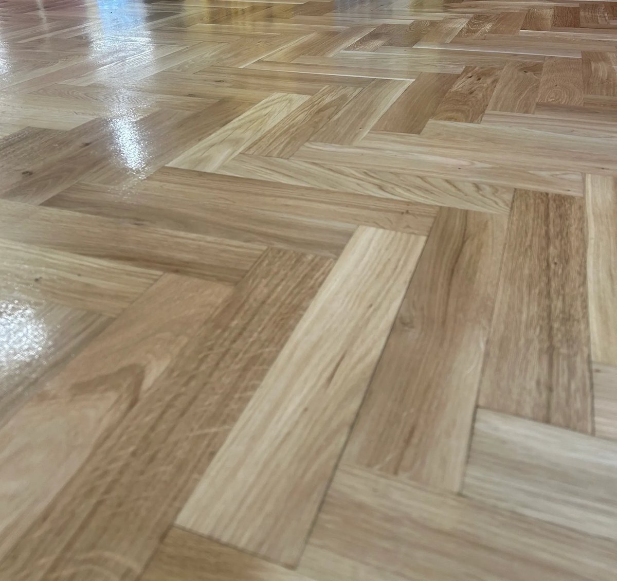 Polished herringbone wood floor