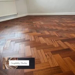 Finished wood floor with company logo