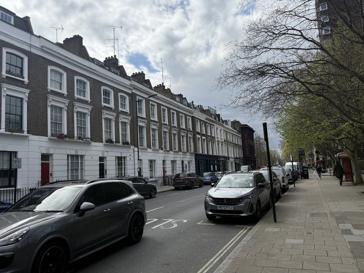 Street view of buildings, potentially relevant to surveying.
