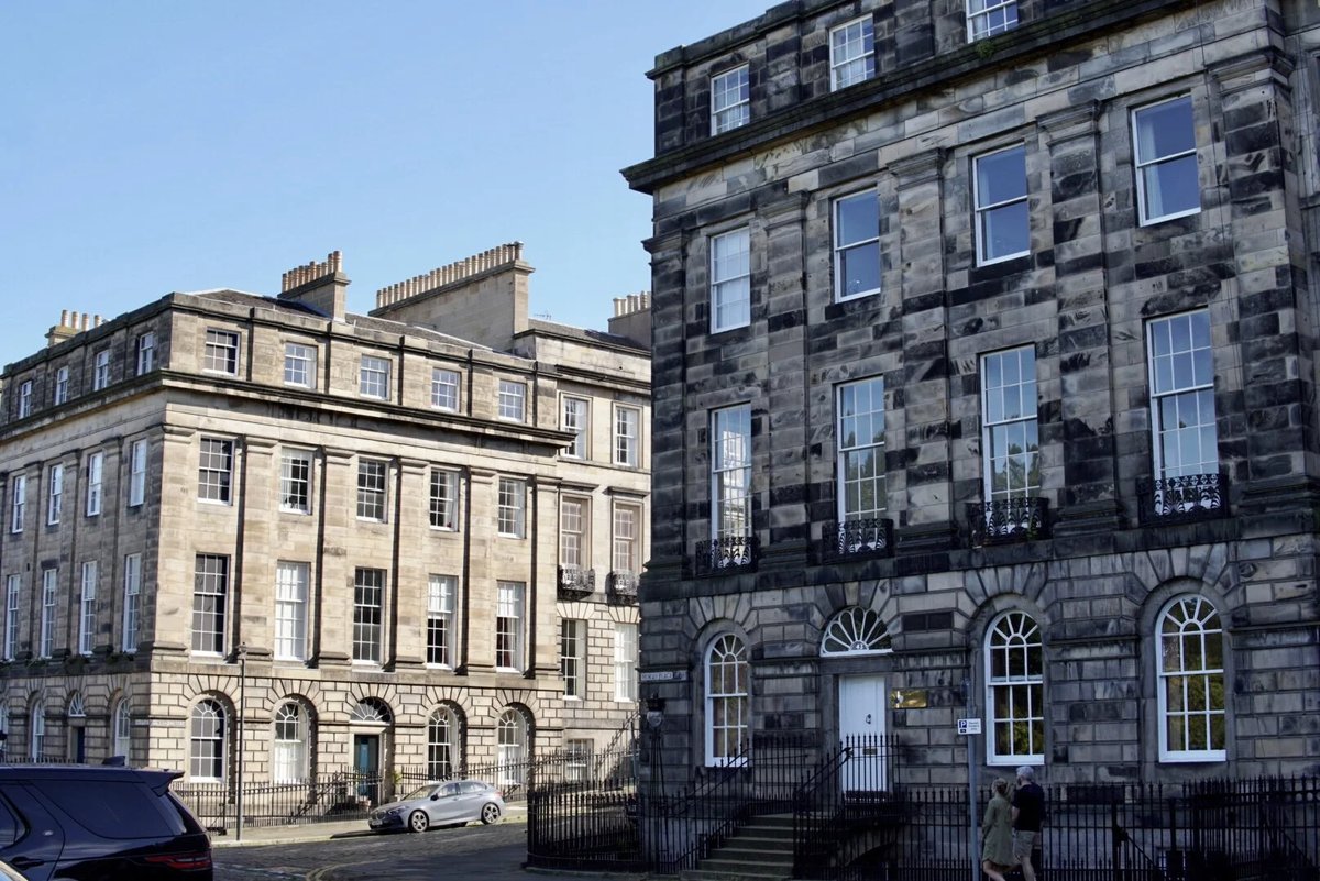 Exterior shot of period buildings showcasing windows.