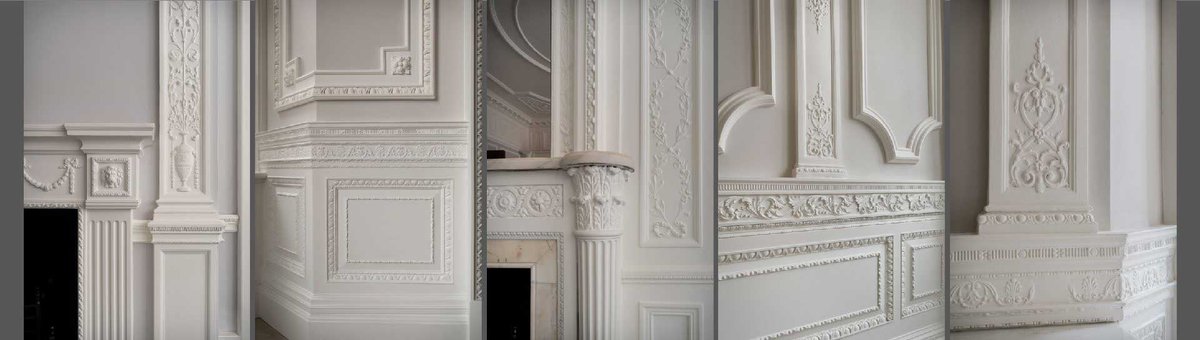 Detailed plasterwork on walls and fireplace.