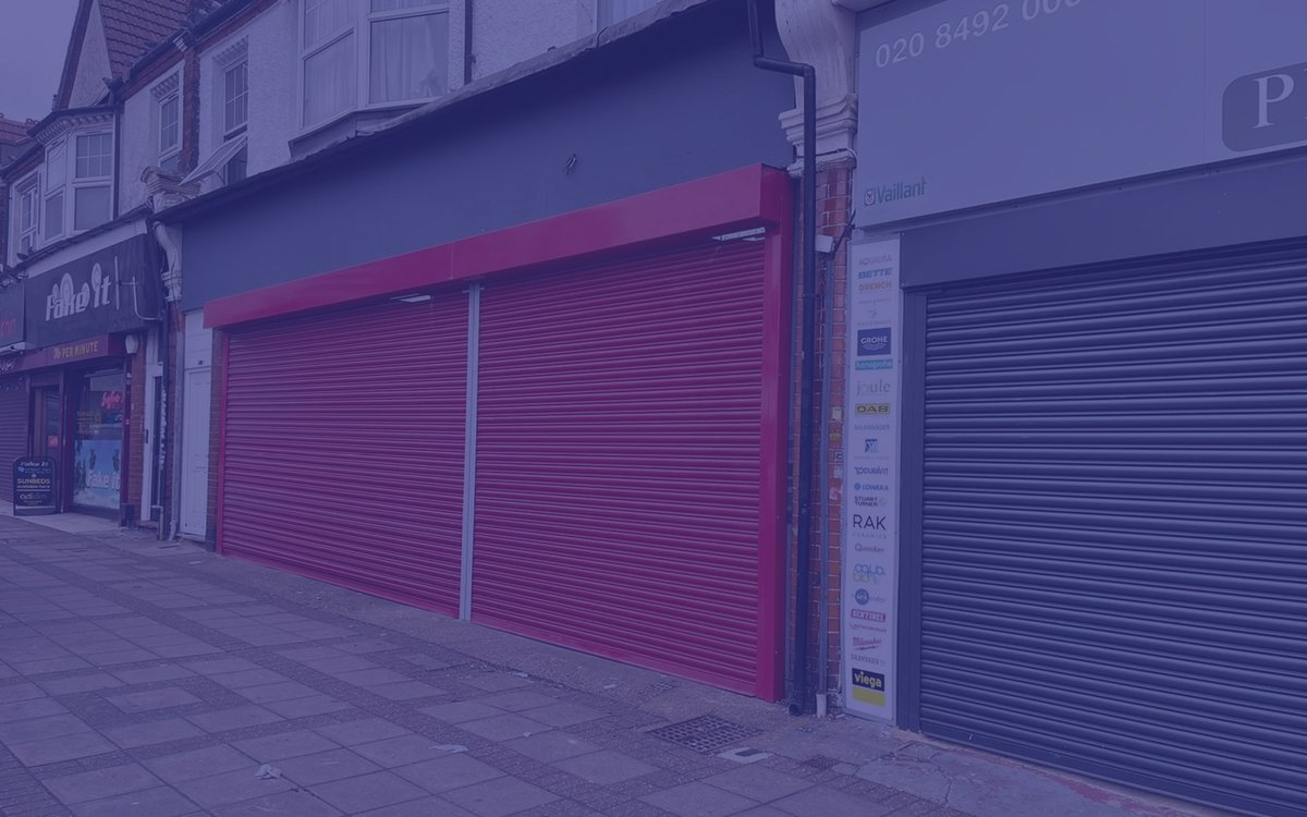 Shopfront with roller shutters, demonstrating their shopfitting and shutter services.