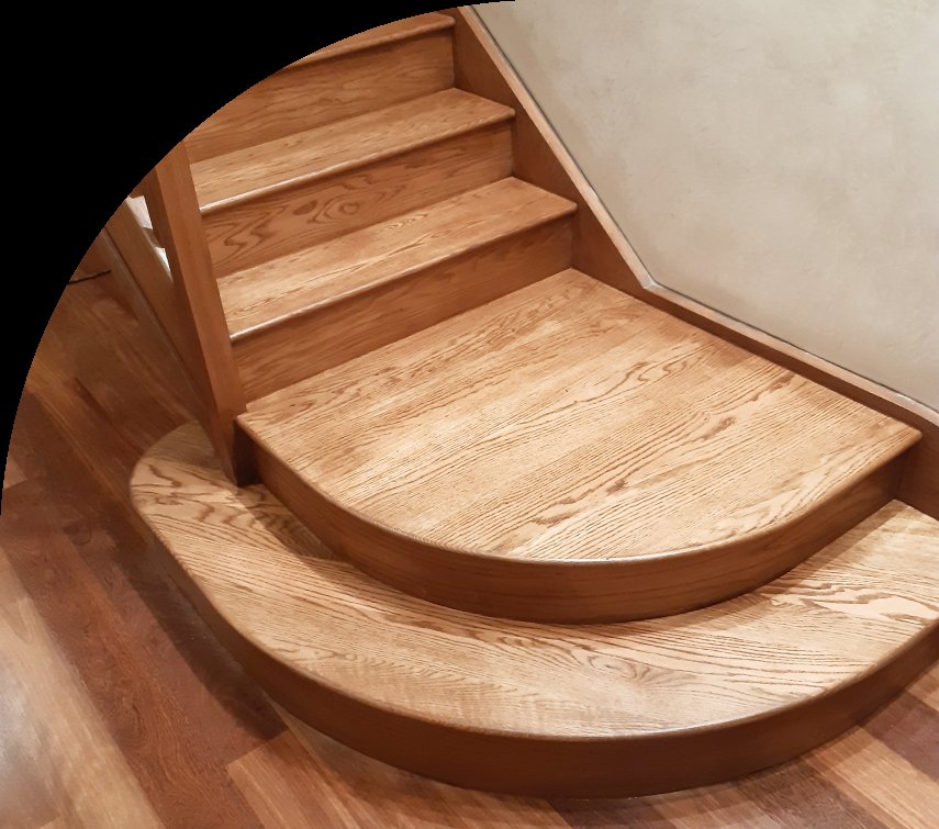 Wooden staircase with curved steps, showcasing detailed craftsmanship.