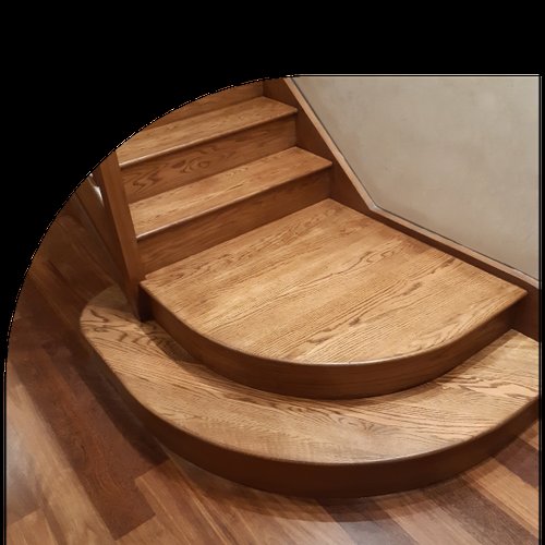 Wooden staircase with curved steps, showcasing detailed craftsmanship.