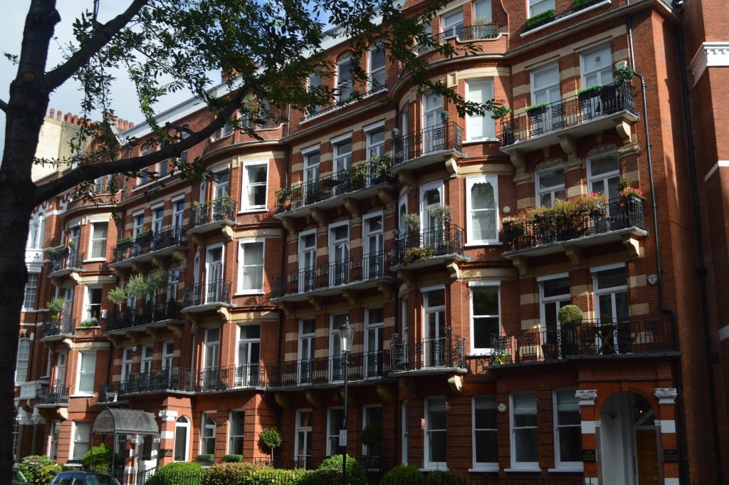 Exterior shot of period buildings with balconies, relevant to valuation and restoration.