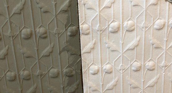 Close-up of ornate plasterwork, showing detail.
