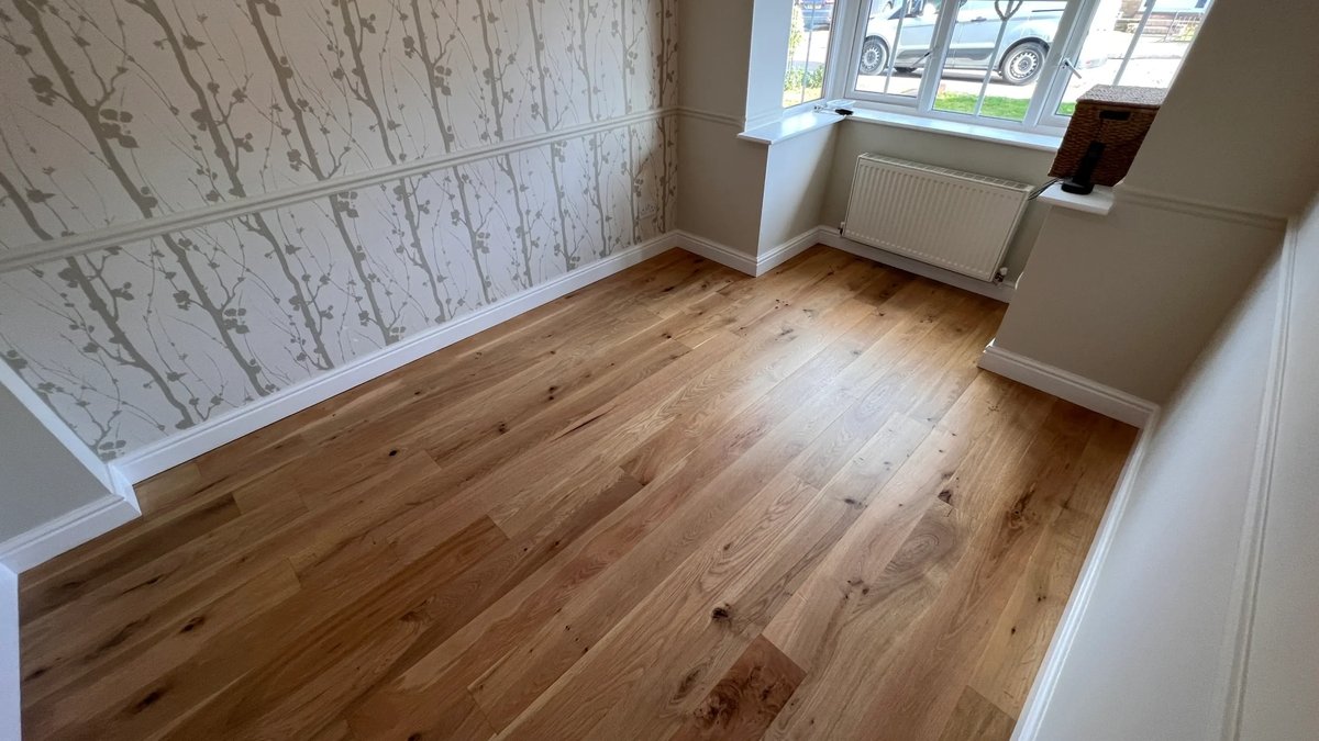 Restored wood floor in a small room.