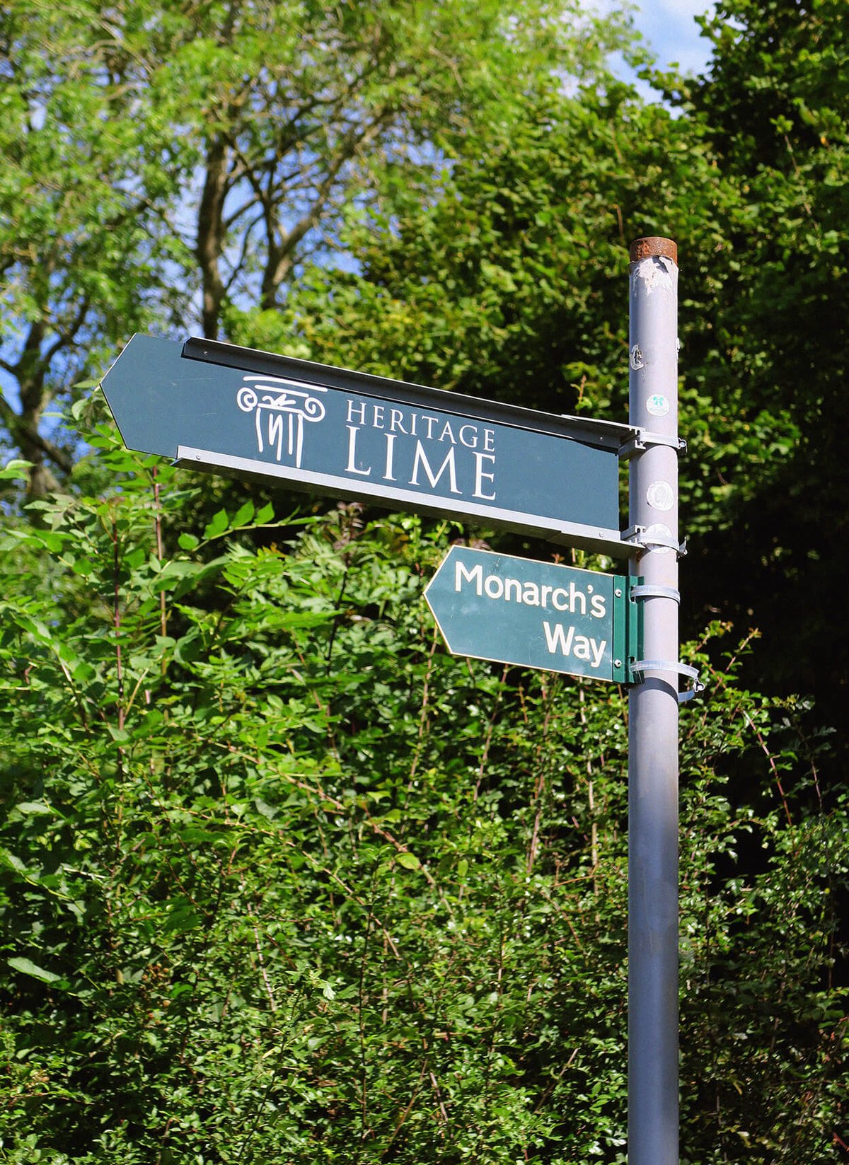 Signpost with Heritage Lime logo.