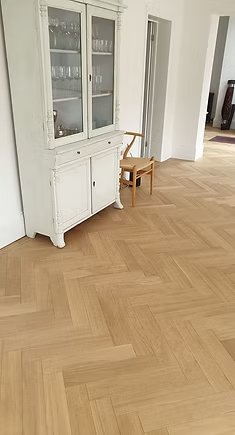 Restored parquet flooring in a room setting