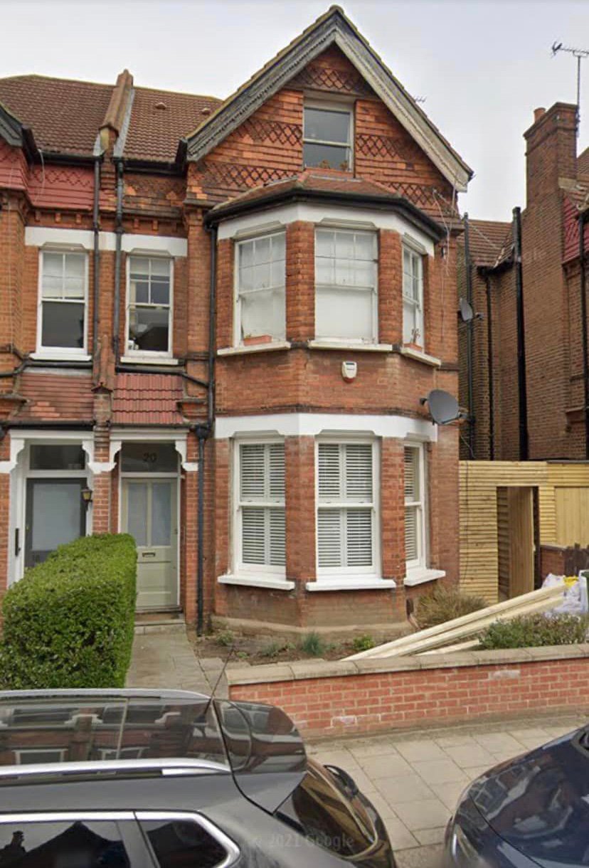 Red brick period home, showing potential roofing and brickwork restoration opportunities.