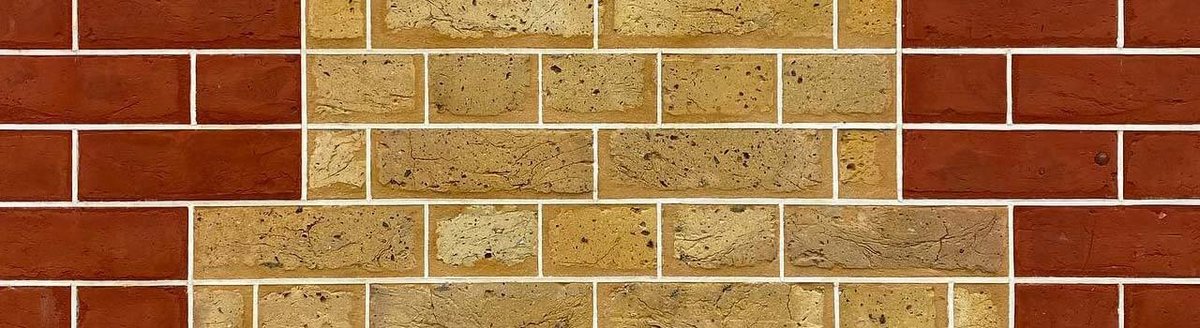 Similar to the first image, highlighting brickwork with different brick colors and repointing work.