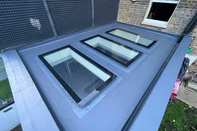 Flat roof with skylights, showcasing modern roofing solutions.