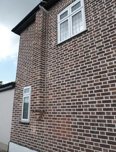 Shows a large brick wall, highlighting brickwork and pointing, likely showcasing their work.