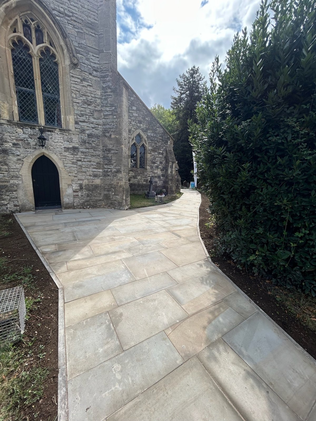 Stone pathway leading to a stone building
